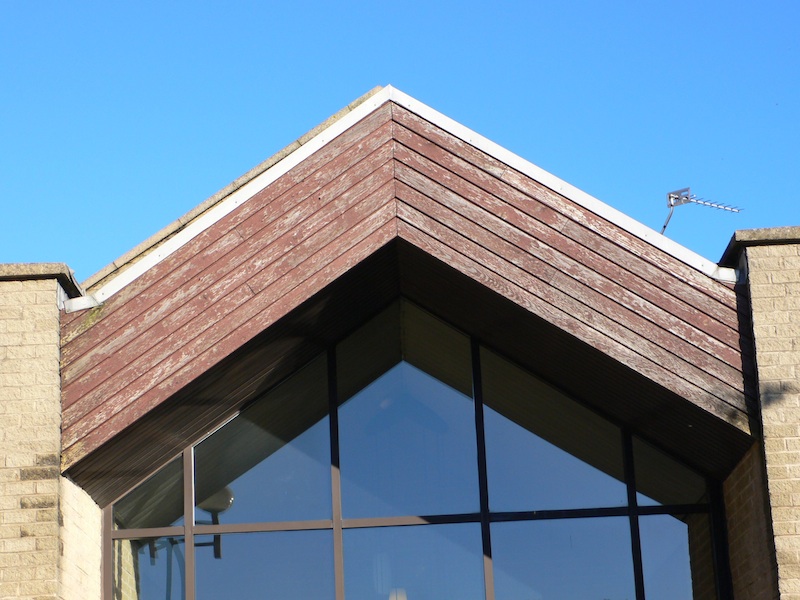 Rotting School building cedar cladding